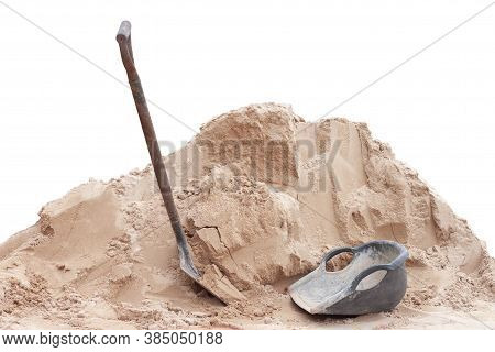 Pile Of Sand, Shovel And Clam-shell Shaped Basket In Construction Site Isolated On White Background 