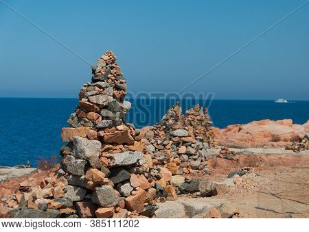 Sardinia Coastline: Typical Red Rocks And Cliffs Near Sea In Arbatax; Italy