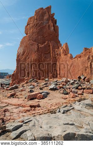Sardinia Coastline: Typical Red Rocks And Cliffs Near Sea In Arbatax; Italy