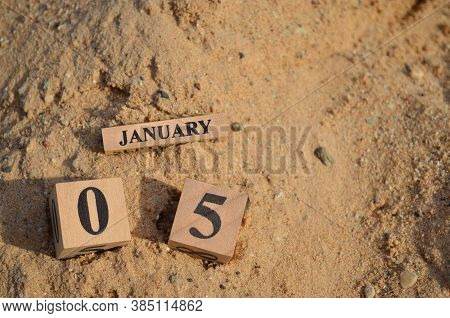 January 5, Number Cube With A Sand Background.
