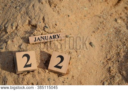 January 22, Number Cube With A Sand Background.