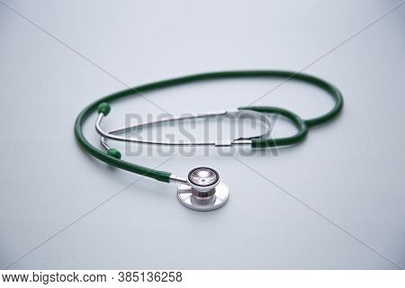 Stethophonendoscope On A Green Background.concept Of Medical Services And Insurance Of Medical Servi