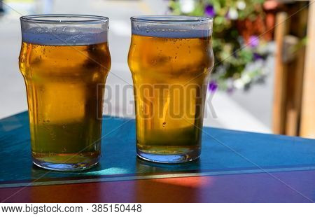 French Cold Beer In Misted Glasses Served On Outdoor Terrace In Small Alpine Village In France
