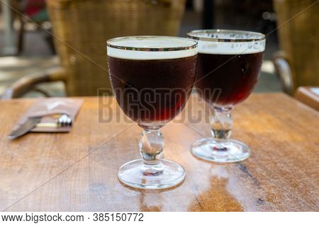 Glasses With Cold Dark Strong Belgian Beer Served Outdoor