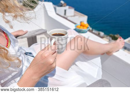 Woman Hand Holding Coffee Cup On Terrace Bacony Of House Or Hotel Sea View