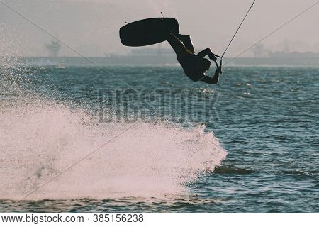 Wakeboarding At The Sea Jumping High Doing A Backflip.
