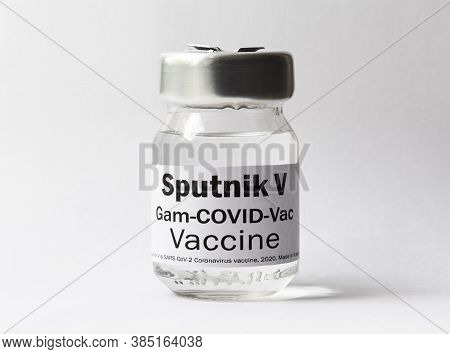 Covid-19 Coronavirus Vaccine Sputnik V On White Background, Bottle With Russian Vaccine For Sars-cov