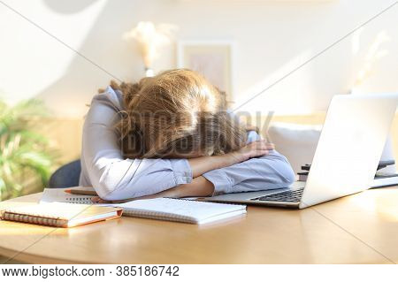Tired Overworked Woman Resting While She Was Working Writing Notes.