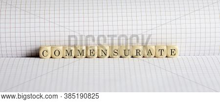 Concept Commensurate. Words Written On Wooden Block On Notebook. Leadership Concept.