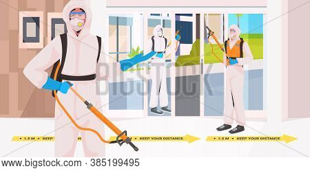 Professional Cleaners In Hazmat Suits Janitors Team Cleaning And Disinfecting Floor To Prevent Coron