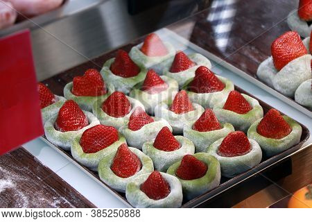 Green Tea Flavor Mochi With Strawberry Put Row On The Tray In The Glass For Sale. Mochi Is A Short-g