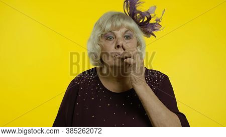 Funny Stupid Senior Old Woman Picking Nose With Silly Brainless Humorous Expression, Removing Booger