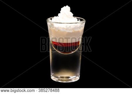 Arabian Blowjob Alcoholic Cocktail In A Shot Glass, Isolated On Black Background