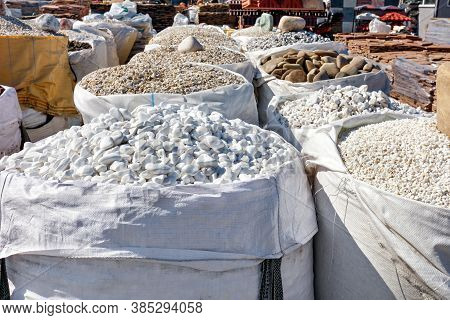 Large Bags Of Stones Of Different Colors And Fractions On Sale For Interior And Exterior Building Fi