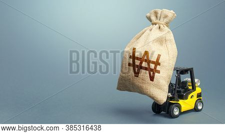 Forklift Carrying A South Korean Won Money Bag. Strongest Financial Assistance, Business Support. St