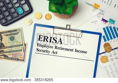 Paper With Erisa - Employee Retirement Income Security Act On The Table, Calculator And Glasses