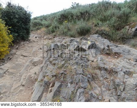 Camino De Santiago Path Going On Natural Slate Stones In Montes De Leon - Leon Mountains - Near El A