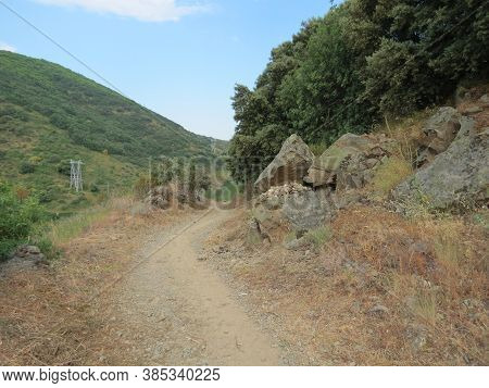 Camino De Santiago Path Going On Natural Slate Stones In Montes De Leon - Leon Mountains - Near El A