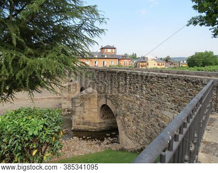 Ancient Roman Bridge Over Meruelo River In Molinaseca, Leon, Spain. Camino De Santiago Goes There.