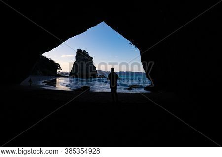 Scenic View Through Natural Arch Of Cathedral Cove On Coromandel Peninsula New Zealand.