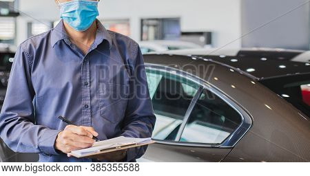 Asian Saleman Wear Surgical Mask Working In Inspector Checking Writing On Clipboard In Garage Of Dea