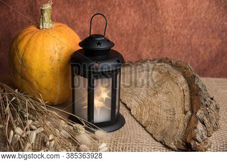 Still-life Painting With A Pumpkin And A Small Lamp