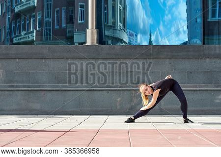 Fitness, Sport, Training, Gym And Lifestyle Concept - Stretching Young Woman With Earphones In The G