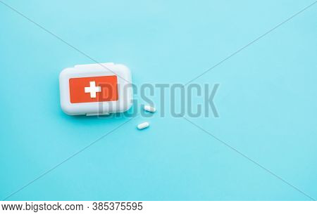 Medicine Box With Aspirin On Blue Color.top Wiew
