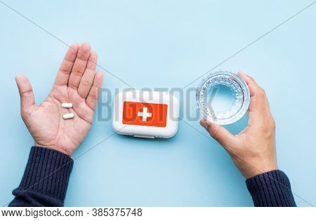 Healthy And Medicine Concepts With Pills On Male Hand.top View