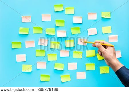 Businessman With Colorful Notepaper On Blue  Background.ideas Creativity Concepts