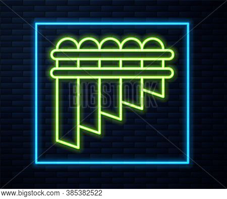 Glowing Neon Line Pan Flute Icon Isolated On Brick Wall Background. Traditional Peruvian Musical Ins