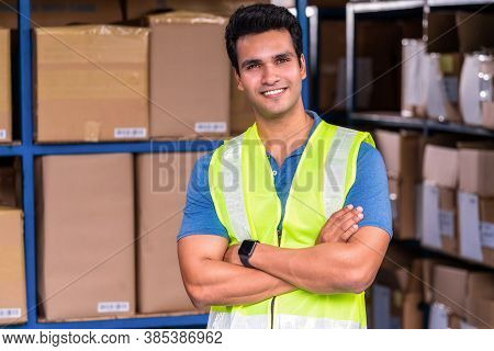Portrait Of Idian Worker Man Standing In Arm Crossed Action In Local Warehouse Before Start His Job,