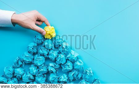 Idea And Creativity Concepts With Person Choosing Outstanding Paper Crumpled Ball In Mountain Shap.t