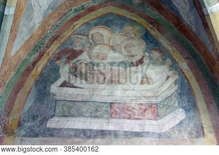 PETROVINA, CROATIA - JULY 22, 2013: Jesus is laid in the tomb, a fresco in the parish church of Saint Peter in Petrovina, Croatia
