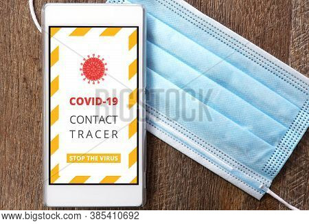 Covid-19 Contact Tracer App On Smart Phone With Face Mask