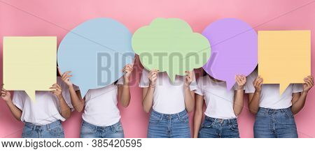Unrecognizabe Ladies Holding Empty Colorful Speech Bubbles In Front Of Heads Standing Over Pink Back