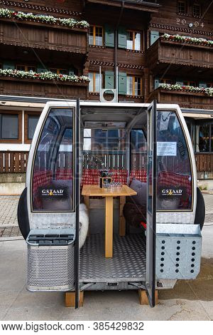 Gstaad, Switzerland - July 16, 2020: Restaurant Table With Glasses In A Ski Kabin