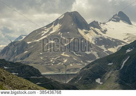 Dam And Wind Farm On Nufenen Pass In Switzerland