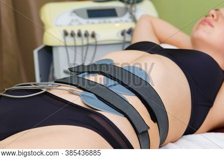 Myostimulation Electrodes Are Installed On The Abdomen. Anticellulite Massage Myostimulation For A B