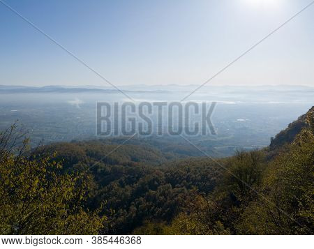 Scenic View From Kozara Mountain To The Valley Filled With Fog And Smoke During A Sunny Day.