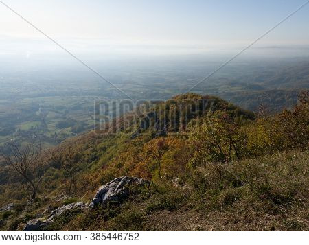 Scenic View From Kozara Mountain To The Valley Filled With Fog And Smoke During A Sunny Day.