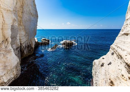 The color of water changes from azure to dark blue. Grottoes Rosh - ha - Nikra - geological formation on the border between Israel and Lebanon. The concept of active and photo tourism