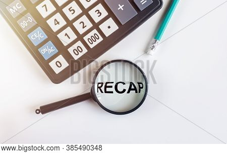 Recap Word Inscription Through Magnifying Glass On White Table With Calculator, Recap In Finance, Su