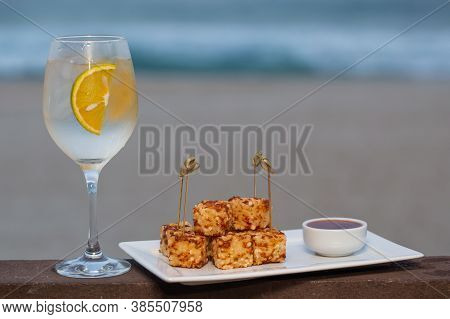 Snack Called Dadinho De Tapioca Made With Rennet Cheese And Tapioca Flour, Served With Pepper Jelly.