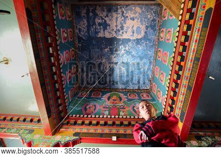 Rinchenpong, Sikkim, India - 17th October 2016 : One Young Boy Lama Standing Inside Prayer Room At R