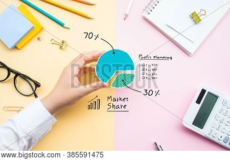 Market Share Concepts With Business Person Sharing Chart Diagram On Desk Table Office.investment And