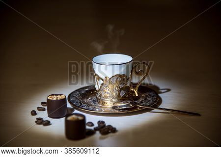 A Golden Coffee Cup, A Spoon, Chocolate And Coffee Beans, Smell The Coffee, Elegance Style Concept