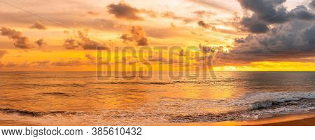 Panorama Of How To Set The Sun, Beautiful Glorious Golden Sunset Above The Sea In Evening.