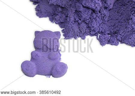 The Kinetic Sand Is Purple And The Ficurs Of It On A White Background. The Material Is Convenient To