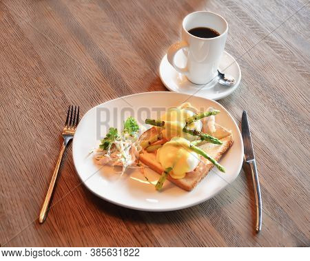 Classic Dutch Breakfast: Black Coffee, Poached Egg On Toasted White Bread With Bacon, Young Asparagu
